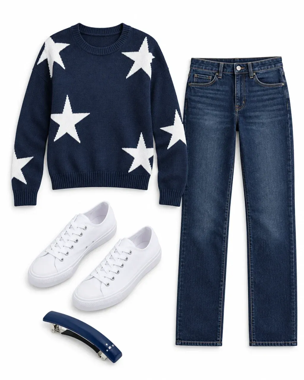 Navy sweater with white stars, dark straight-leg jeans, white canvas sneakers and a navy barrette arranged on white.