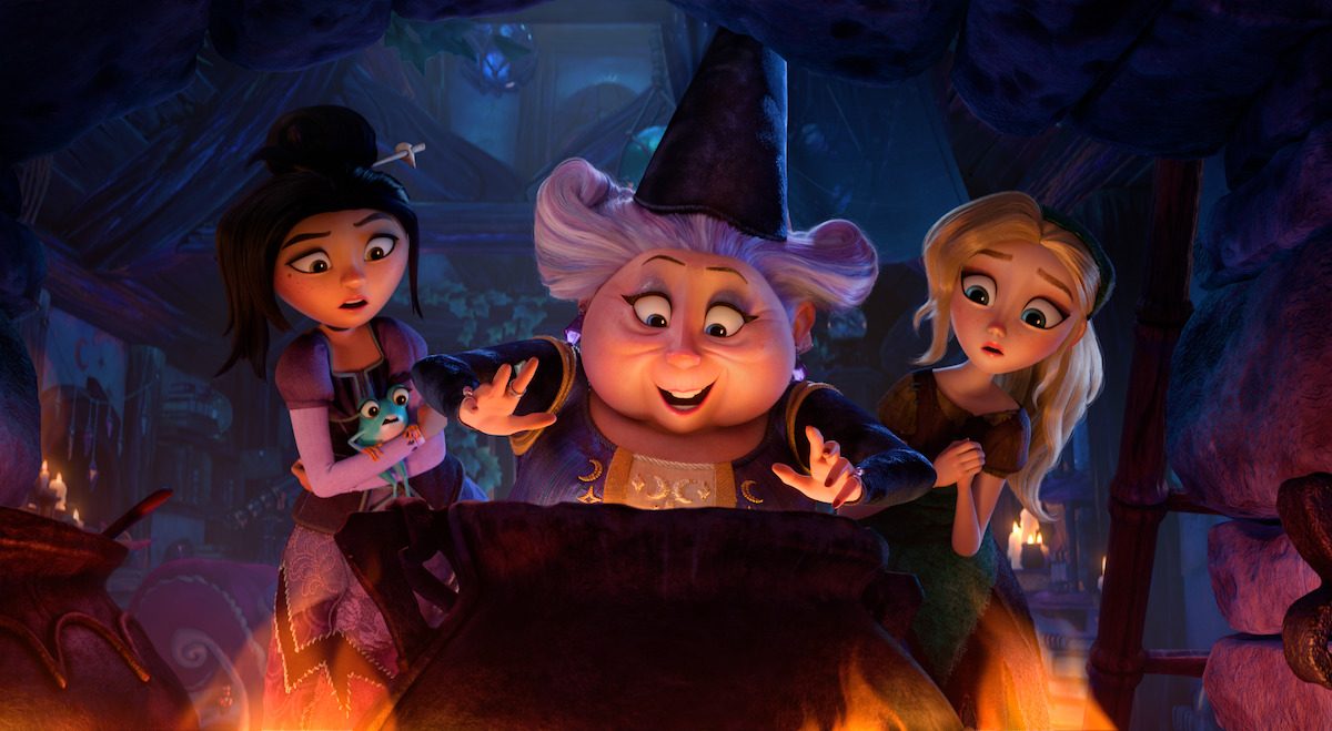 Lilith, frog Margot, Fairy Godmother and Cinderella gathered around a cauldron in Steps
