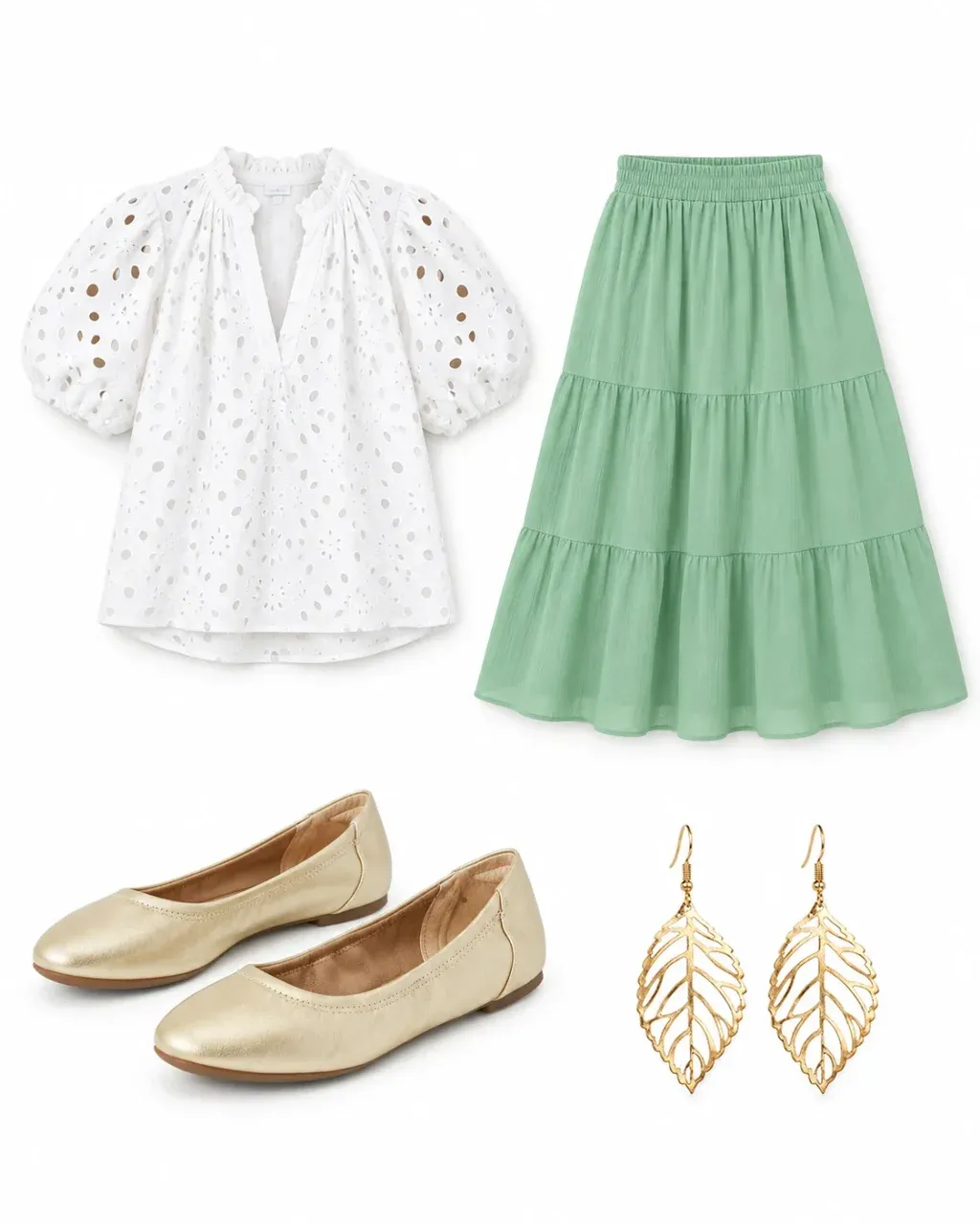 White eyelet puff-sleeve blouse, light sage tiered midi skirt, pale gold flats and gold leaf earrings arranged on white.